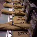Embroidery machine showing "The Green Room" embroidery